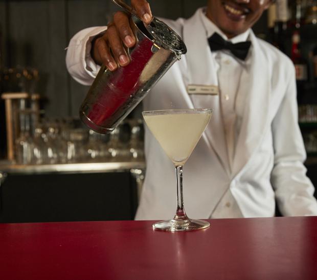 Bartender pouring a cocktail