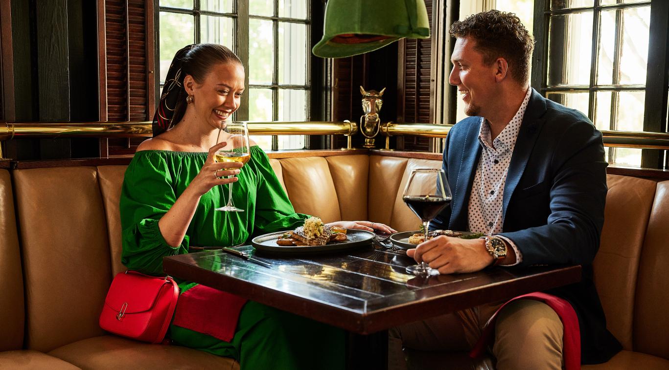 Couple enjoying Inside Dining at Jockey Club on Mackinac Island