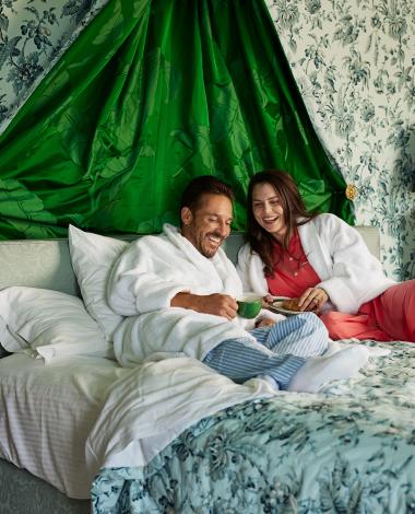 couple relaxing in bed