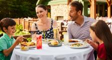 Family enjoying a meal at Woods on Mackinac Island