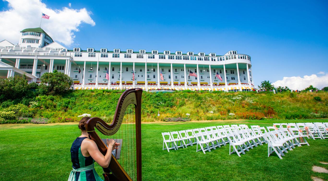 A harpist on the lawn