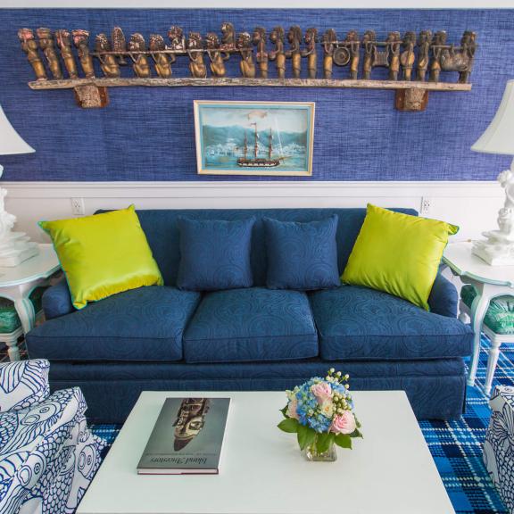 A blue sofa in the sitting room