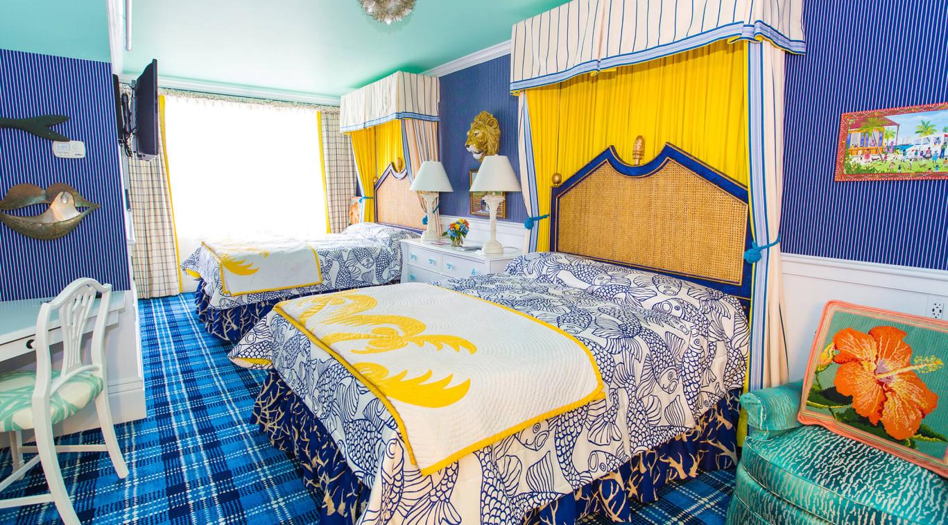 A bedroom with two beds in Cupola Suites