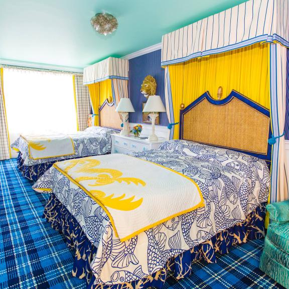 A bedroom with two beds in Cupola Suites