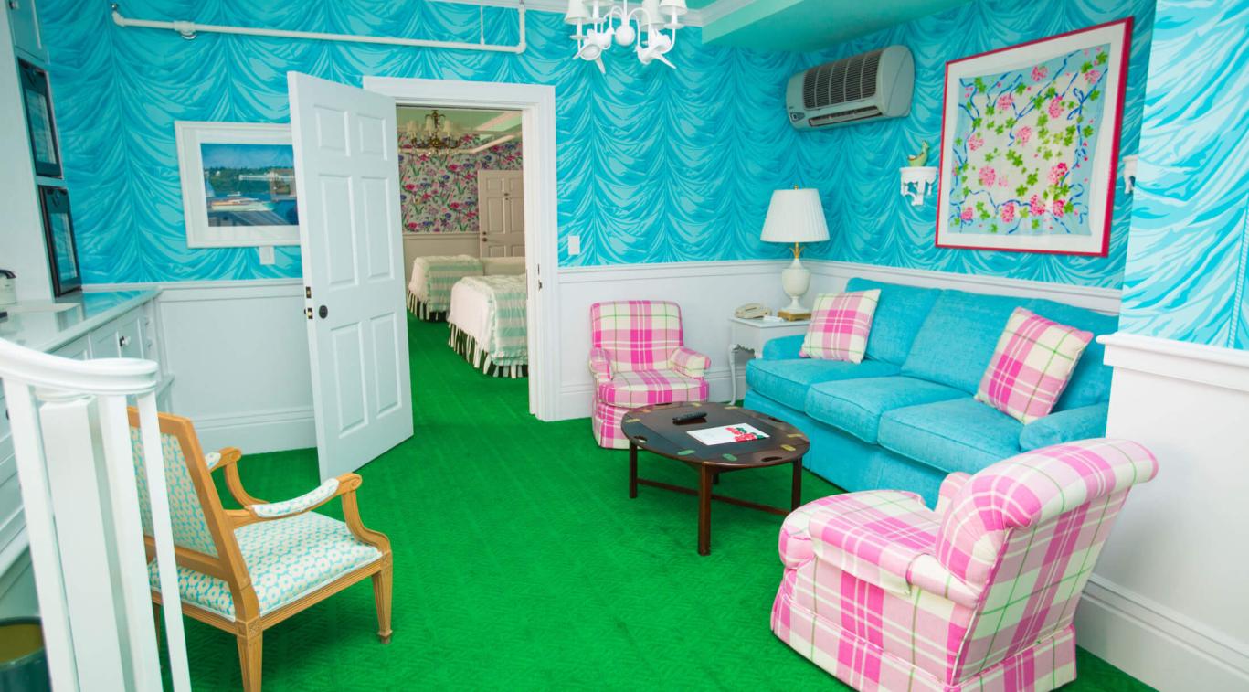 A sitting room next to the bedroom door of Cupola Suite