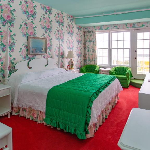 A guest room with a balcony