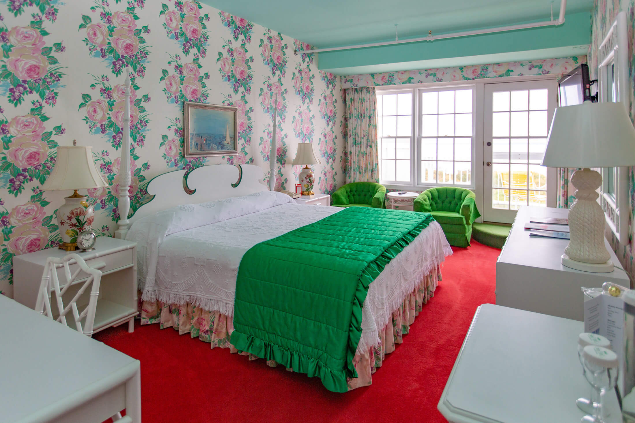 A guest room with a balcony