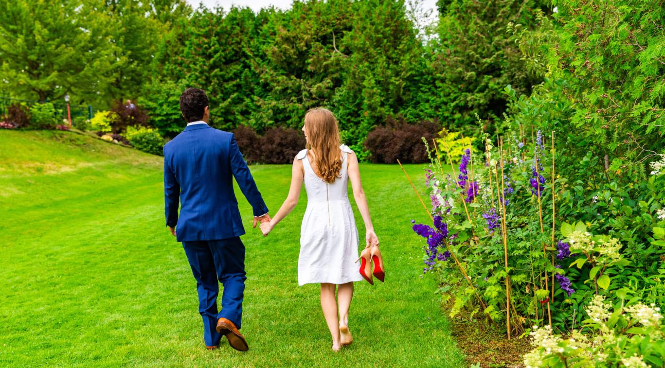 A couple walking on the lawn