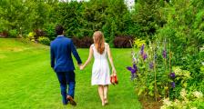 A couple walking on the lawn