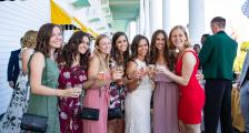 Groups of women with wine glasses on front porch