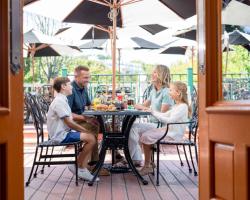 Family enjoying a meal at The Gate House.
