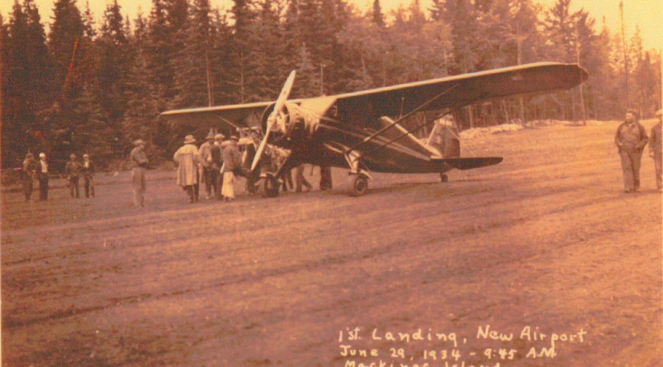 An old photo of an airplane labelled 