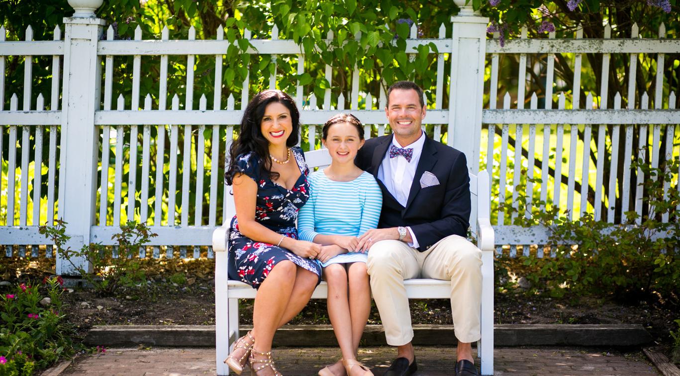 Parents with child on bench