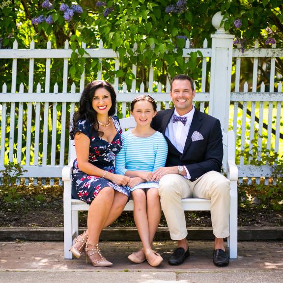 Parents with child on bench