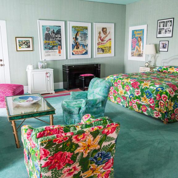 Esther Williams Suite with bed and living room furniture