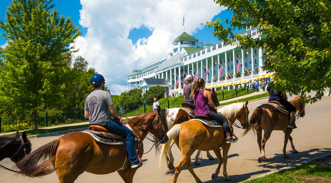 horseback riding in front of the Grand Hotel