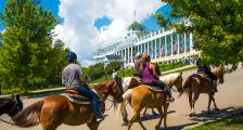 horseback riding in front of the Grand Hotel