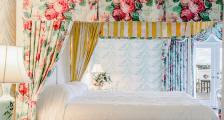 Guest room with floral canopy