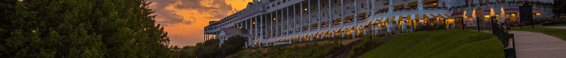 View of Hotel Grand from the front lawn with sunset