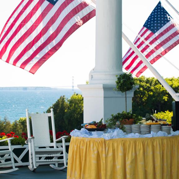 A catered table overlooking the bridge on the porch