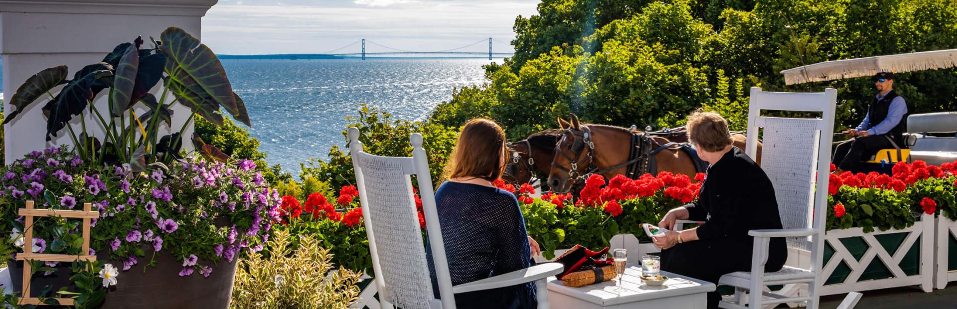 Two people sitting on rocking chairs