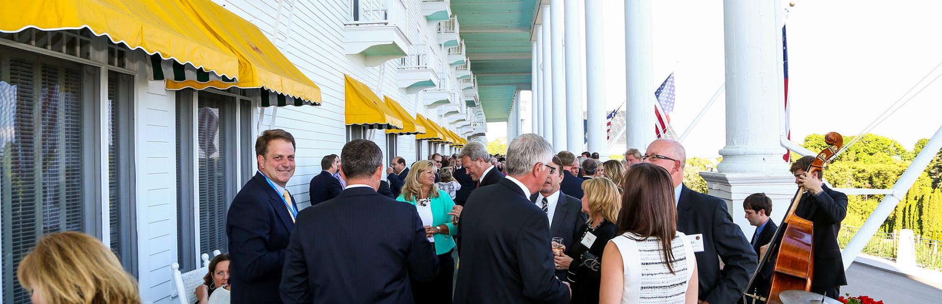 Group of people celebrating on front porch