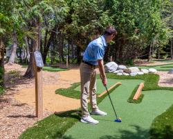guest playing golf at Grand Hotel Mackinac