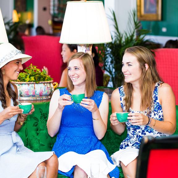 Ladies drinking tea in parlor