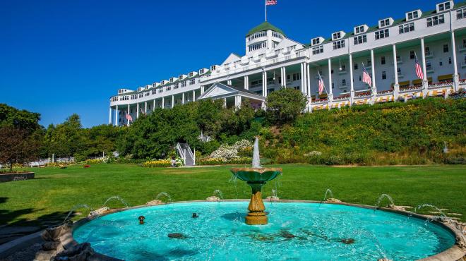 Front lawn view of Grand Hotel and its fountain