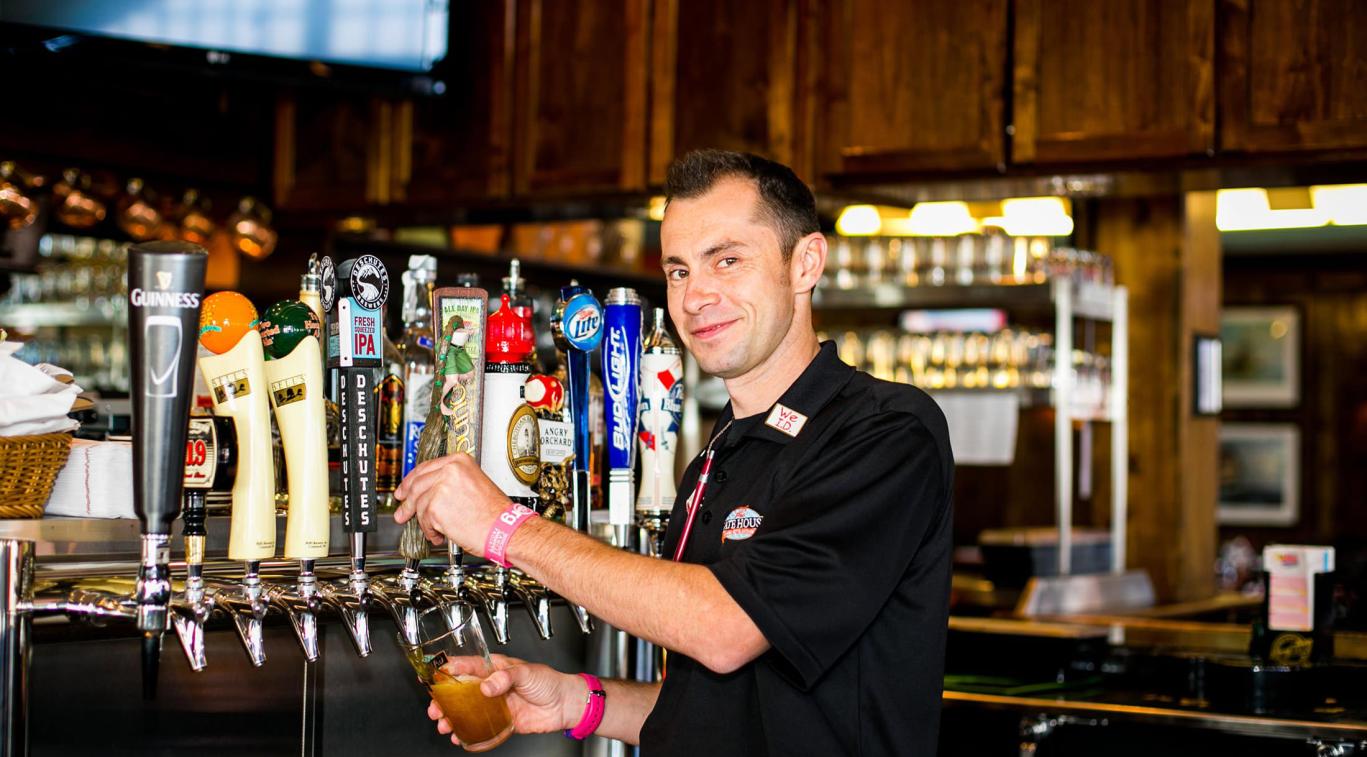 A bartender at The Gate House