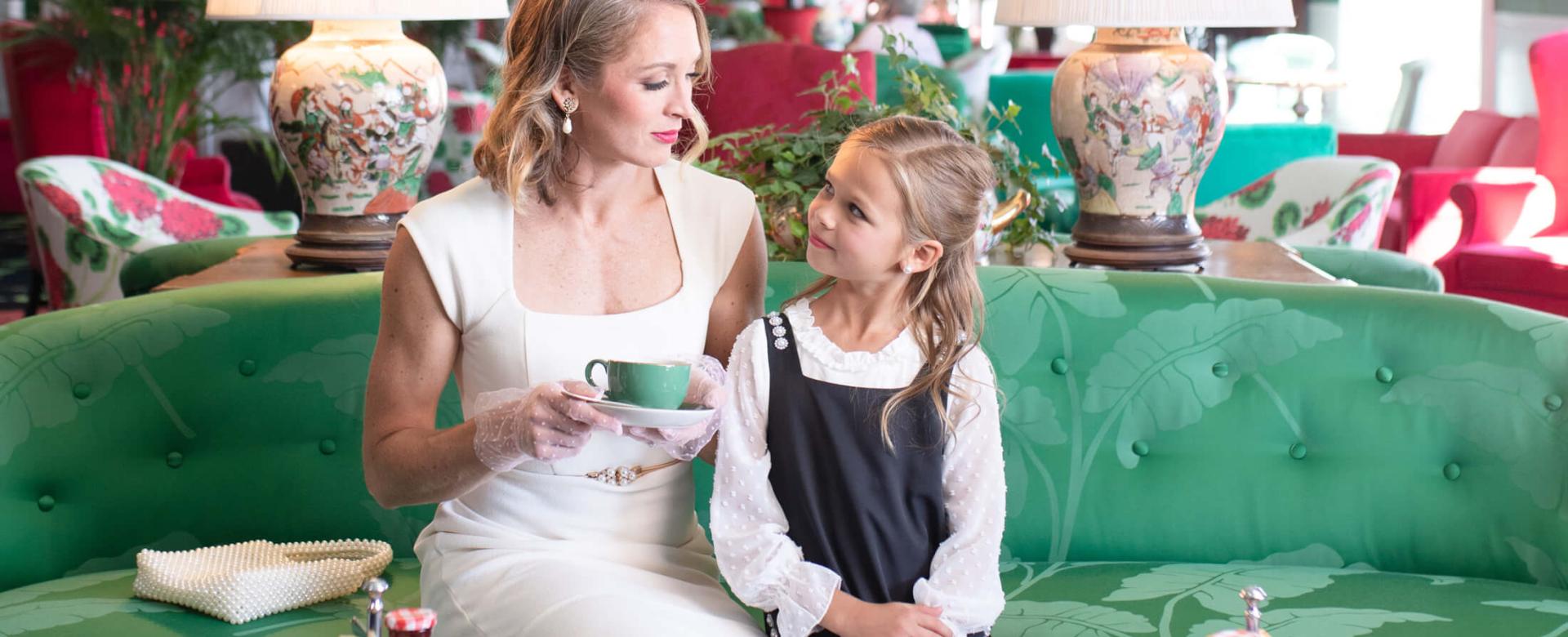 Mom and daughter enjoying afternoon tea in the parlor at Grand Hotel