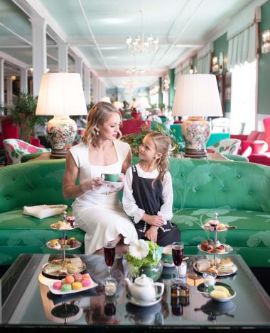 Mom and daughter enjoying afternoon tea in the parlor at Grand Hotel