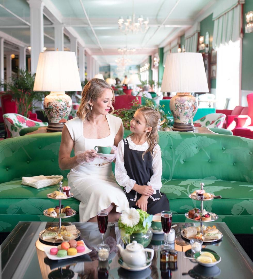 Mom and daughter enjoying afternoon tea in the parlor at Grand Hotel