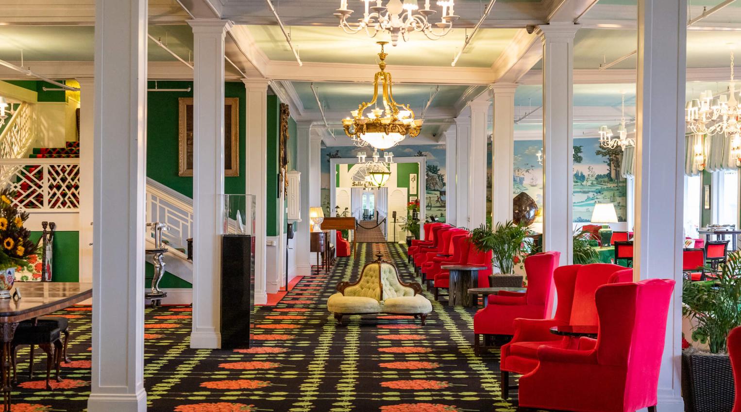 seating area with red chairs