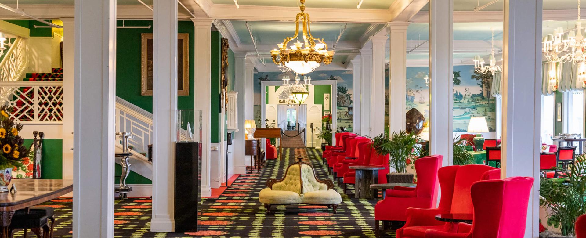 seating area with red chairs