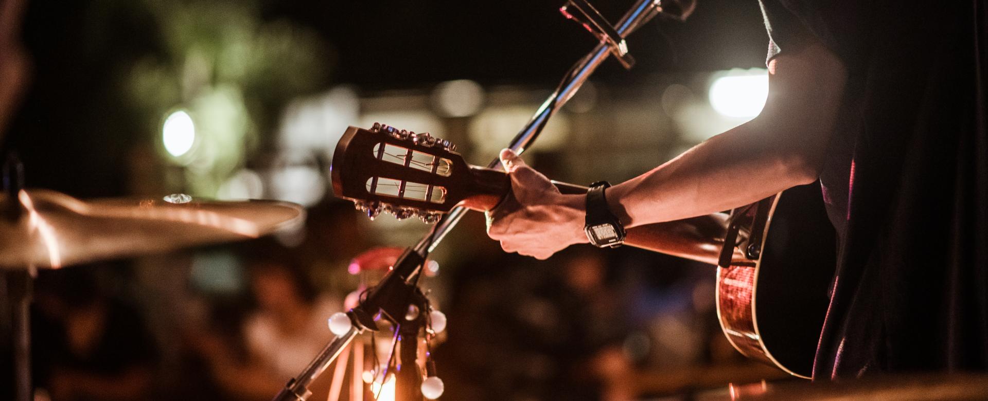 Musicians were playing rock music on stage.