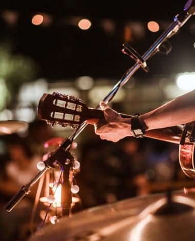 Musicians were playing rock music on stage.