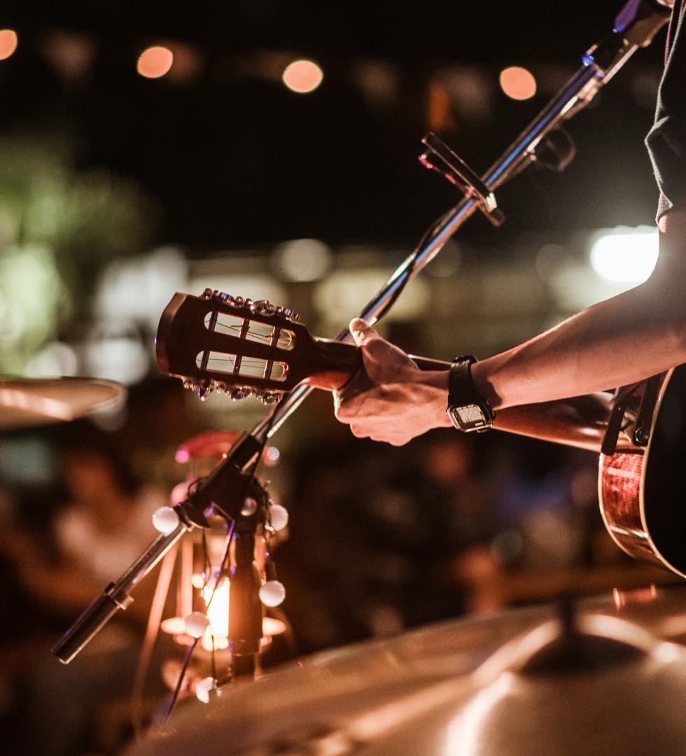 Musicians were playing rock music on stage.