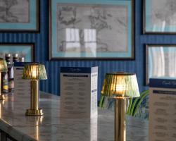 A look inside a luxury suite at Grand Hotel on Mackinac Island, showcasing the iconic and colorful interior design style of Dorothy Draper and Carleton Varney.