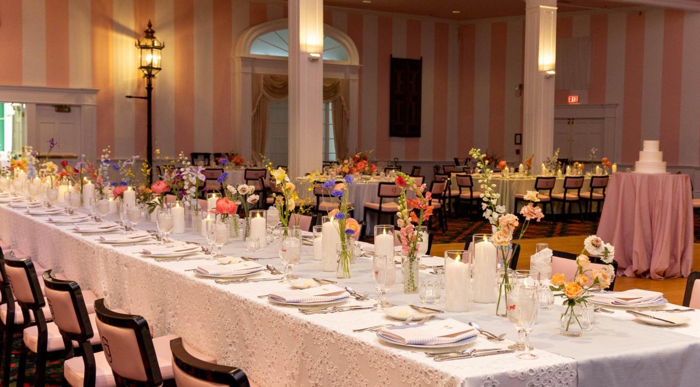 Reception tables with candles and flowers in the Grand Hotel theatre
