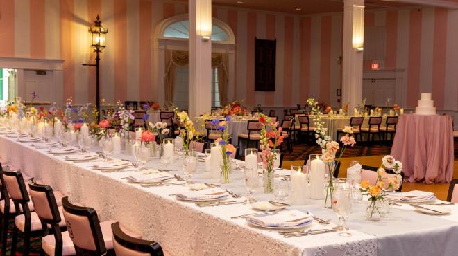 Reception tables with candles and flowers in the Grand Hotel theatre